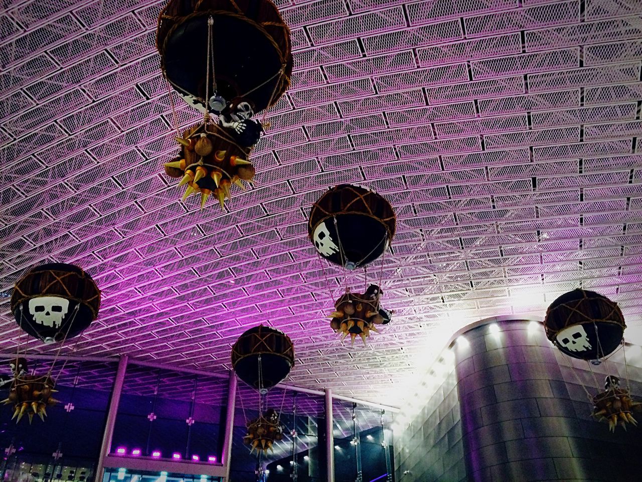low angle view, lighting equipment, illuminated, hanging, built structure, architecture, decoration, building exterior, ceiling, night, lantern, no people, multi colored, electric lamp, pattern, electric light, decor, indoors, celebration