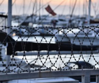 Razor wire fence at harbor