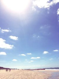 View of beach against cloudy sky