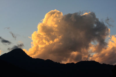 Low angle view of silhouette mountain against sky