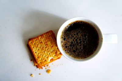 Close-up of coffee cup on white background