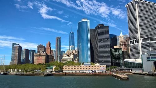 View of skyscrapers against cloudy sky