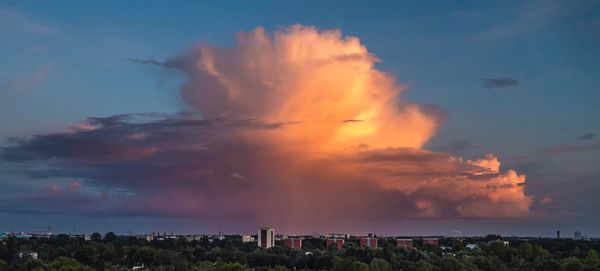 Panoramic view of cityscape against sky during sunset