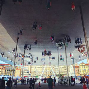 High angle view of people walking on road