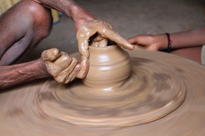 Man making clay pot