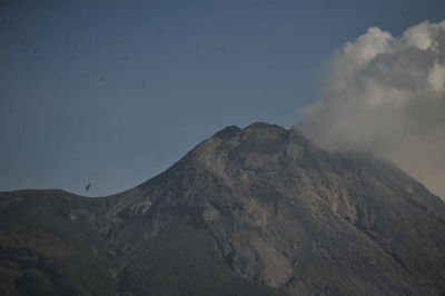 Scenic view of volcanic mountain against sky