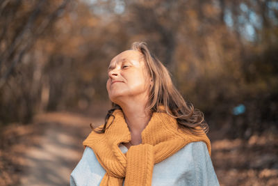 Portrait of a smiling young woman in winter