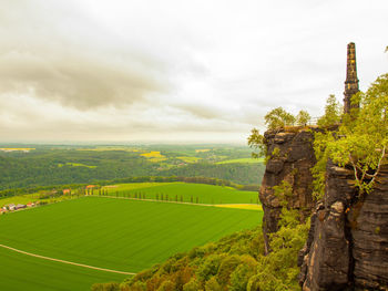Stony memorial post on lilienstein. scenic view of landscape against sky