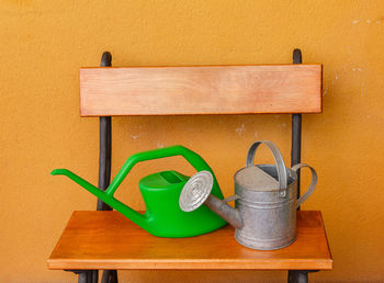 Close-up of carving on table against wall