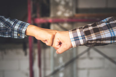 Cropped hand of person holding hands