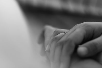 Close-up of hands on table