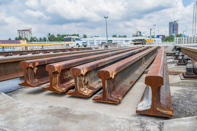 Railroad tracks against sky in city