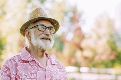 Portrait of smiling young man wearing hat