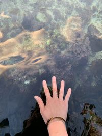 Close up of a hand in clear water