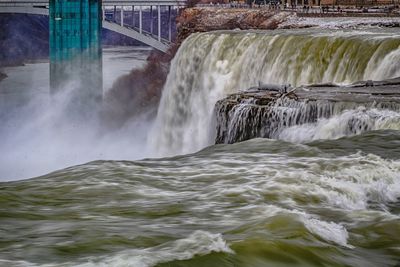 View of waterfall in fog