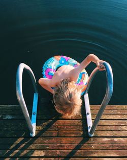 High angle view of boy in lake