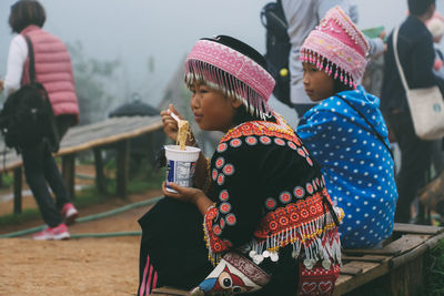 Rear view of a girl holding ice cream