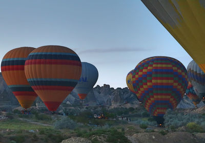 Low angle view of hot air balloons against sky