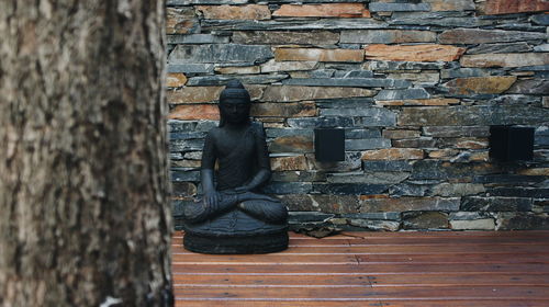 Woman standing on wall