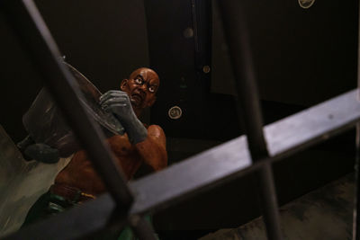 High angle view of man sitting on table