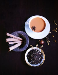 High angle view of tea on table against black background