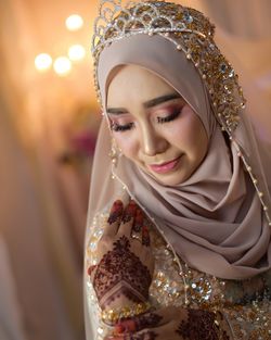 Close-up of bride in make-up and hijab