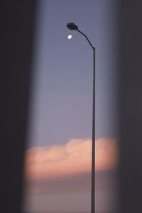 Low angle view of street light against sky during sunset