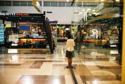 Full length of a man in shopping mall