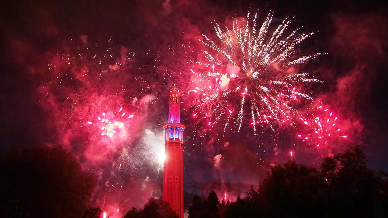 LOW ANGLE VIEW OF FIREWORKS DISPLAY