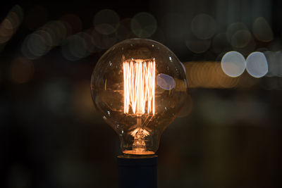 Close-up of illuminated light bulb