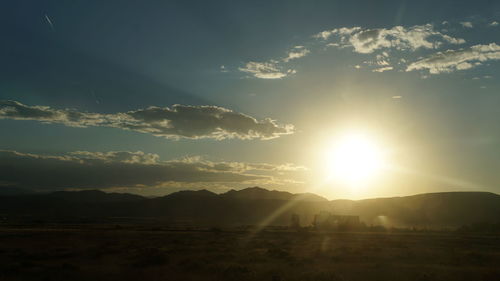 Scenic view of landscape against sky during sunset