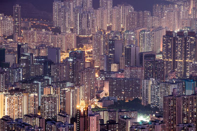 Aerial view of city lit up at night