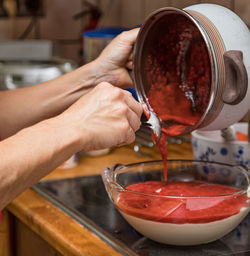 Midsection of man preparing food in kitchen