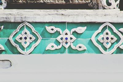 Close-up of wall against blue sky