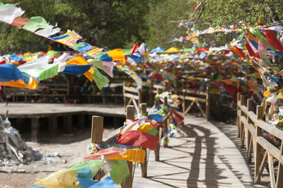 Colorful prayer flags on wooden walkway