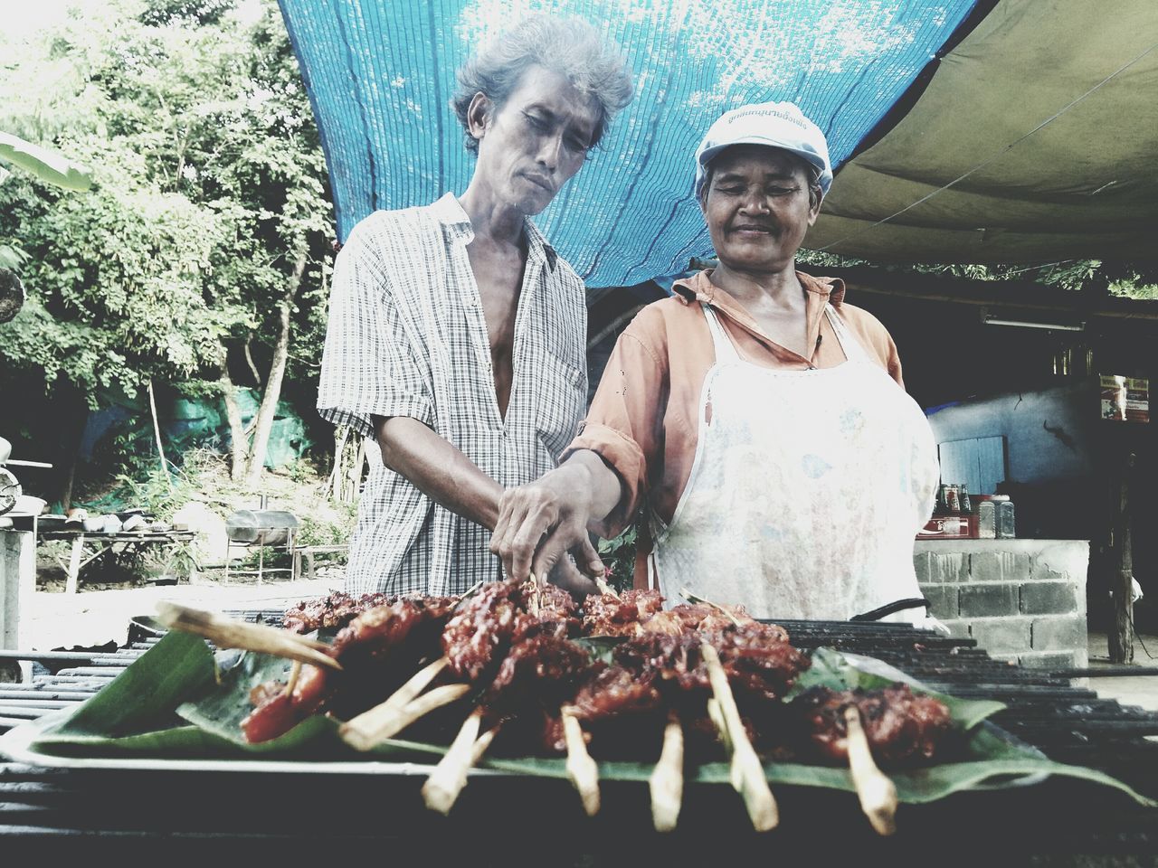 TWO PEOPLE IN TRADITIONAL CLOTHING FOR SALE