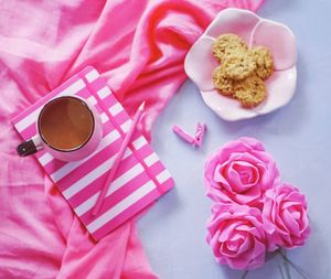 High angle view of pink coffee cup on table