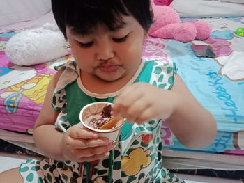 High angle view of girl holding ice cream