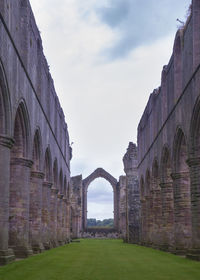 View of historic building against cloudy sky