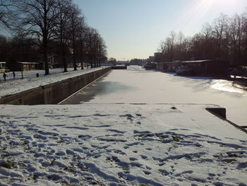 Road passing through snow covered landscape