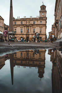 Reflection of buildings in puddle