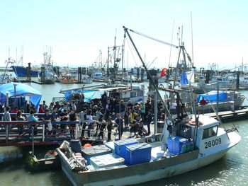 Boats moored at harbor