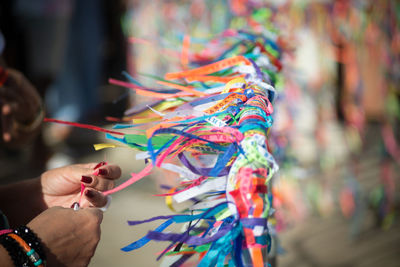 Catholics are seen tying ribbons on the railing of the senhor do bonfim church during an open mass