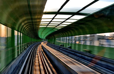 Railroad tracks seen through train windshield