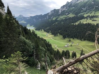 Scenic view of landscape and mountains against sky