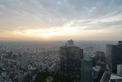 High angle view of buildings against sky during sunset