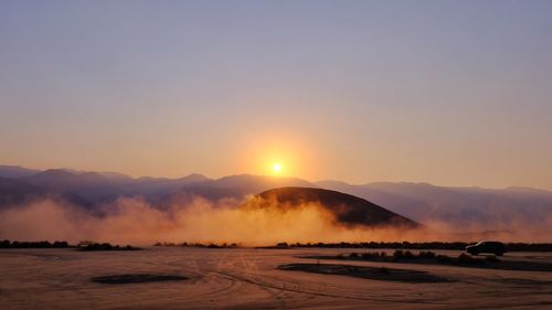 Scenic view of mountains against sky during sunset