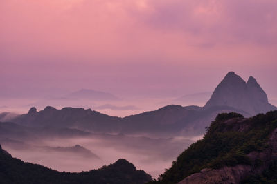 Scenic view of mountains against sky during sunrise