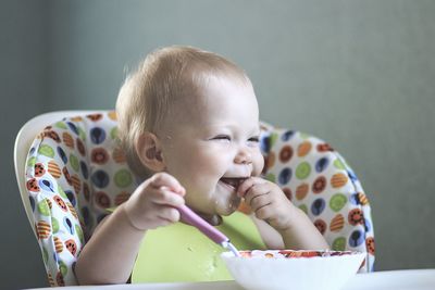 Portrait of cute boy eating food