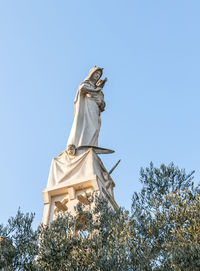 Low angle view of statue against clear sky